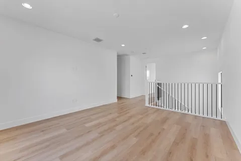 a bathroom with a double vanity sink and a shower