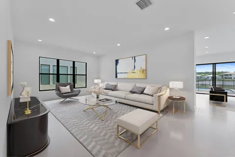 a large kitchen with stainless steel appliances granite countertop a lot of counter space and wooden floors