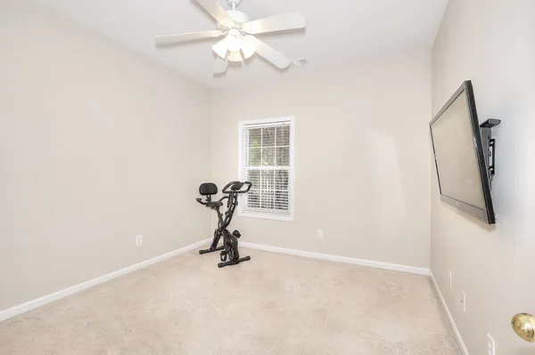 a view of a living room with furniture and a window