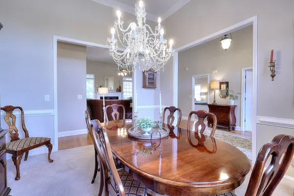 a kitchen with granite countertop a sink stainless steel appliances wooden floor and cabinets