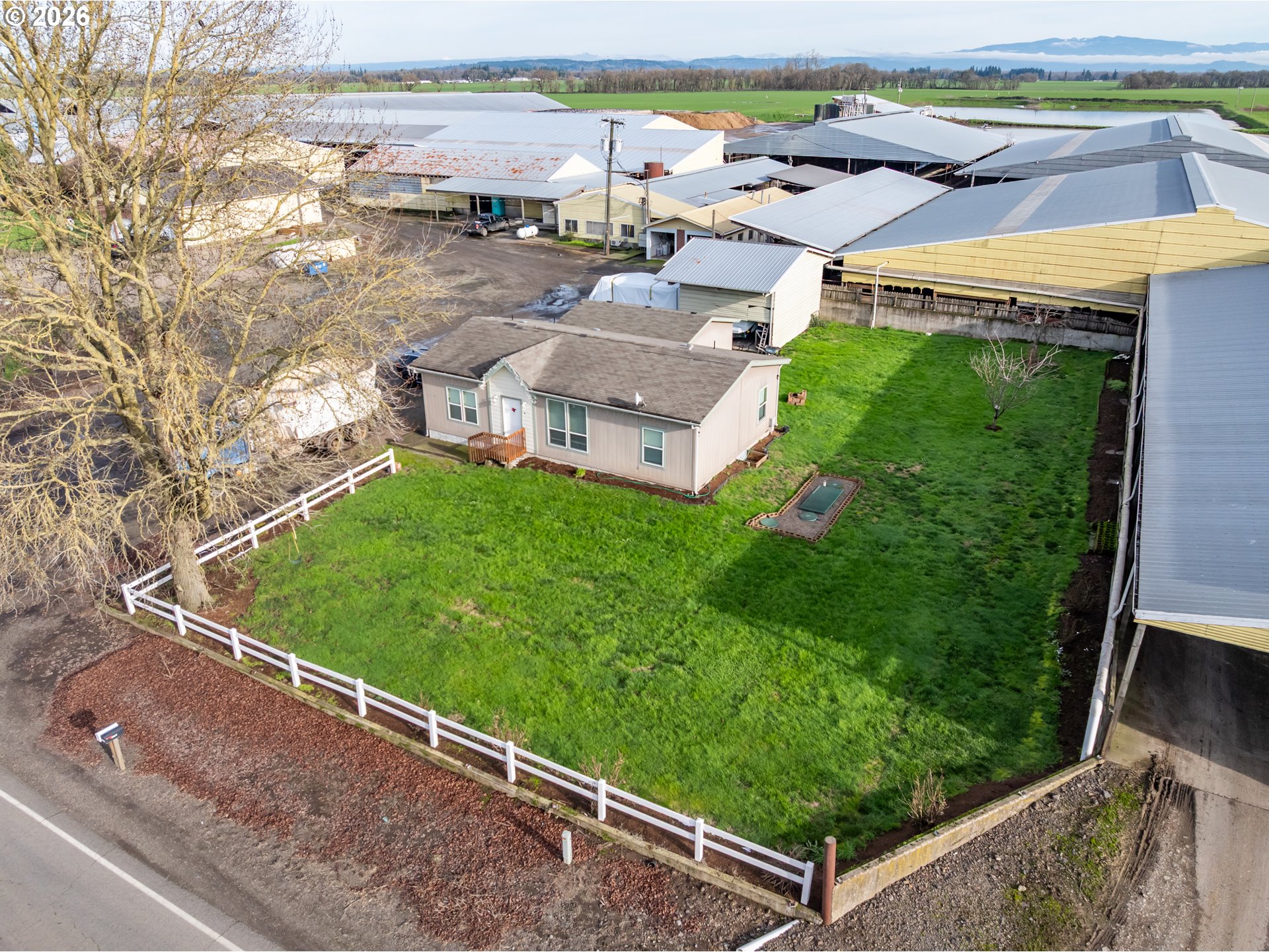 35725 Engel Road Southeast Albany, OR 97322 - Photo 18 of 38 an aerial view of a house with a garden and lake view