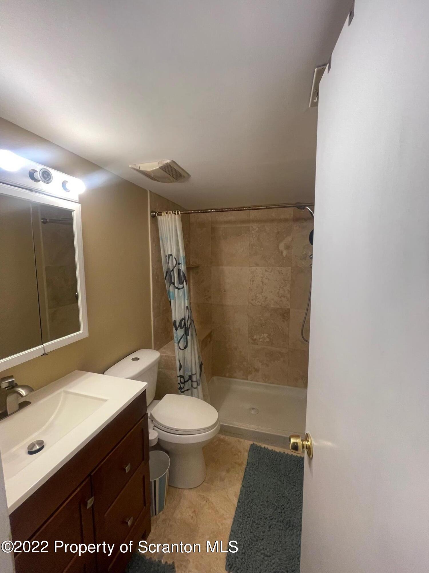 1501 Summit Pointe Scranton, PA 18508 - Photo 11 of 12 a bathroom with a sink toilet and shower