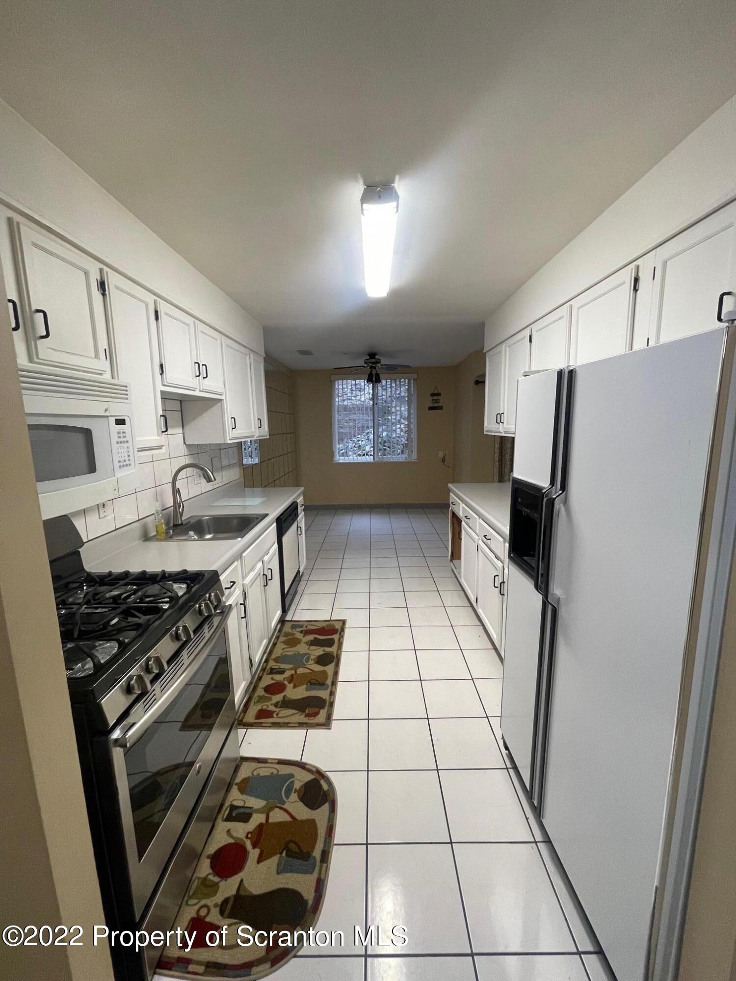 1501 Summit Pointe Scranton, PA 18508 - Photo 2 of 12 a kitchen with stainless steel appliances granite countertop a stove a refrigerator and a stove