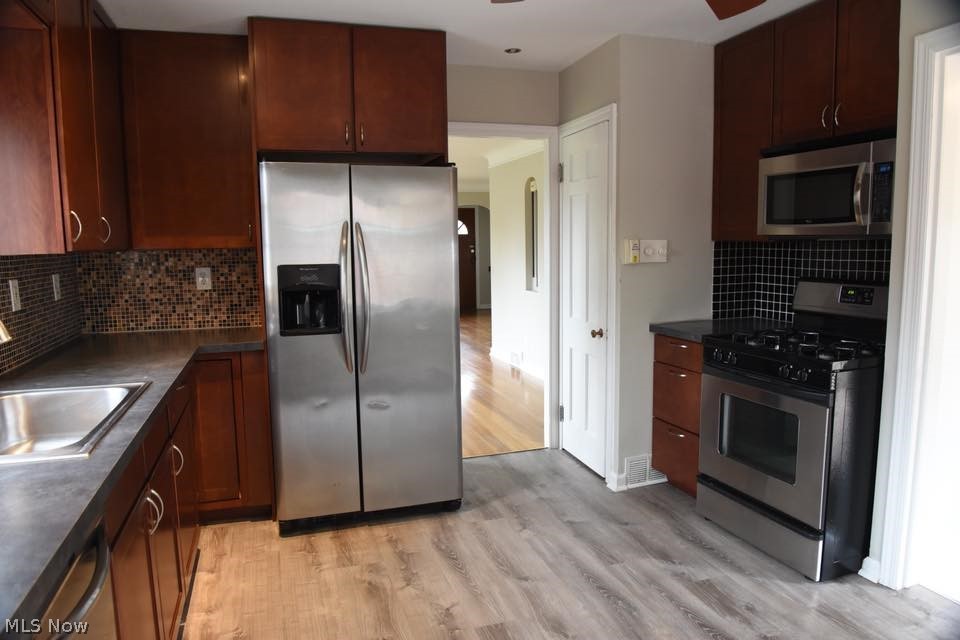 3602 Warren Road Cleveland, OH 44111 - Photo 7 of 24 All stainless appliances stay as does the washer and dryer in basement! Pantry/broom closet shown in photo.