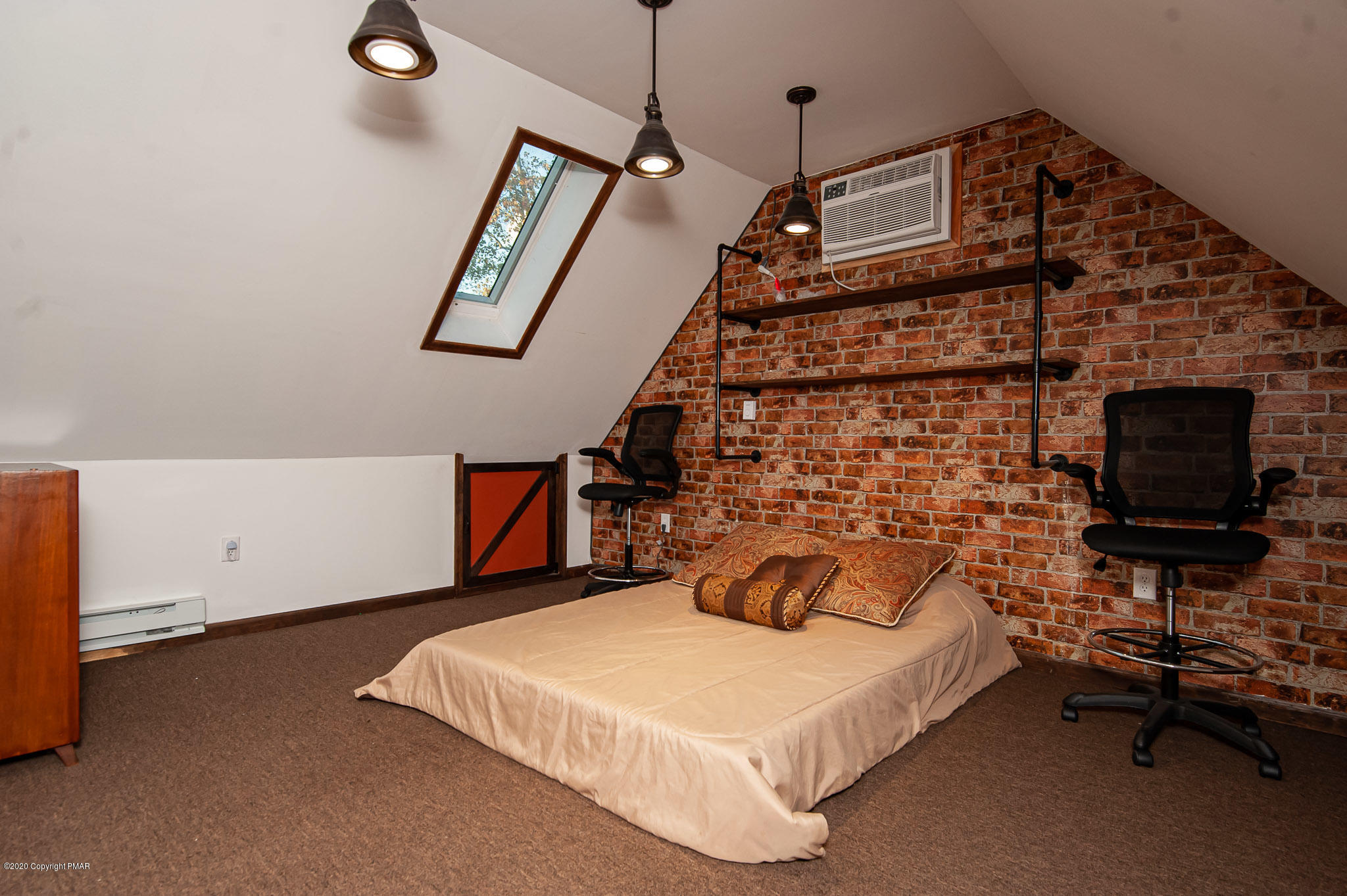 145 Salisbury Road Bushkill, PA 18324 - Photo 18 of 60 a bedroom with a bed and a flat tv screen on the wall