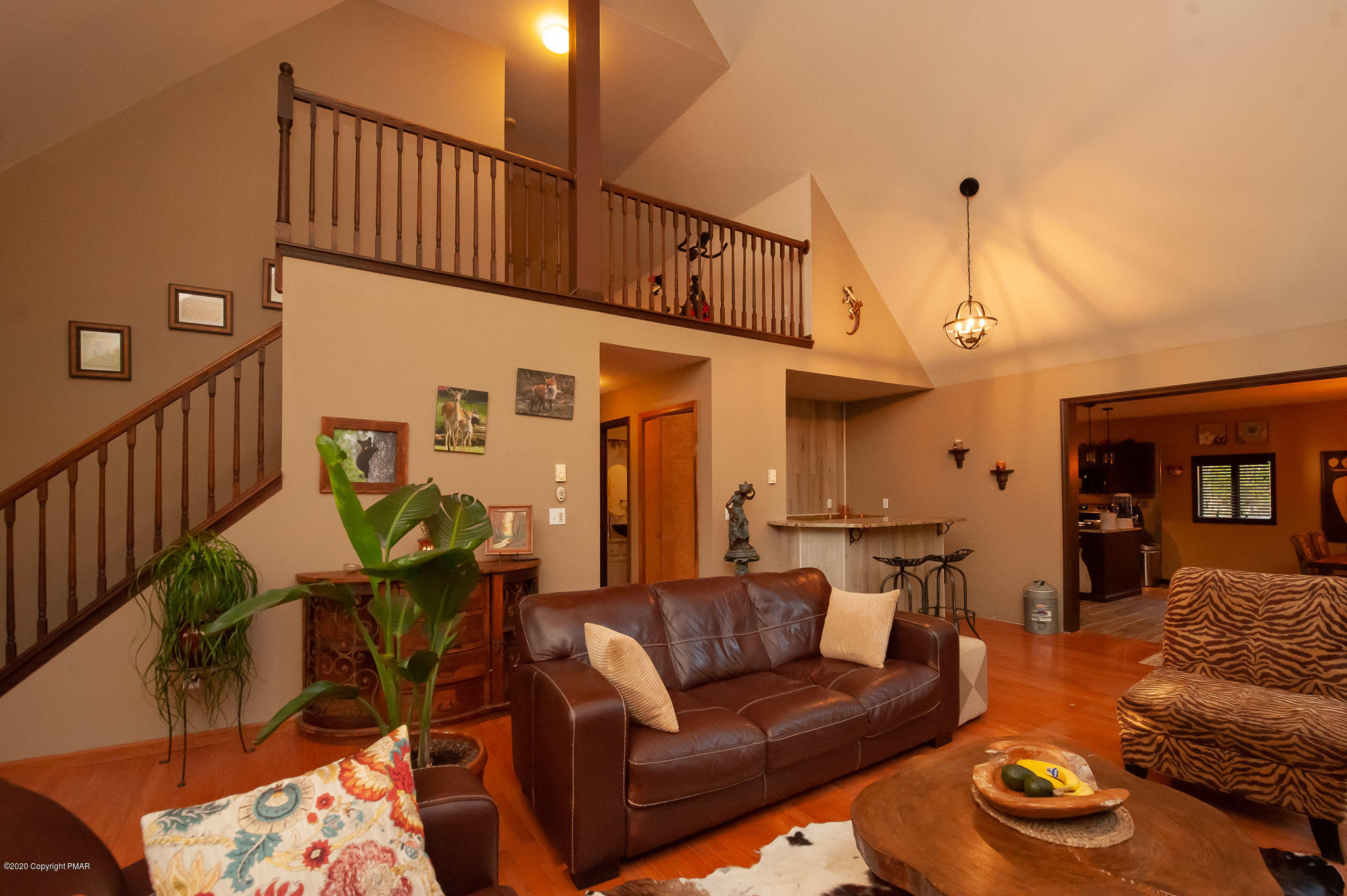 145 Salisbury Road Bushkill, PA 18324 - Photo 27 of 60 a living room with furniture and a chandelier