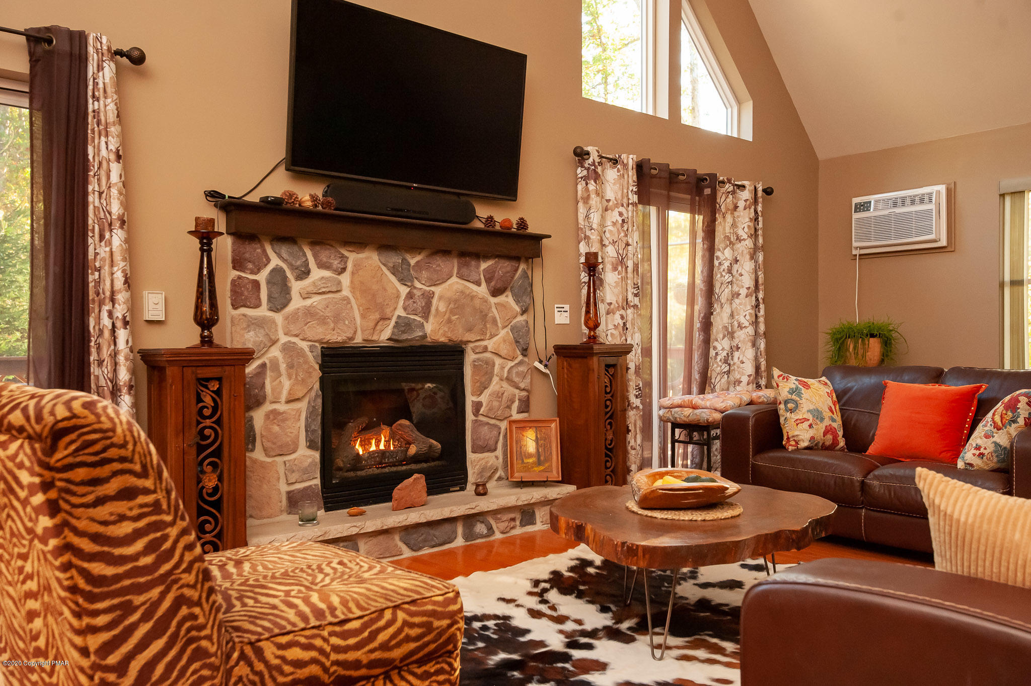 145 Salisbury Road Bushkill, PA 18324 - Photo 29 of 60 a living room with furniture and a fireplace