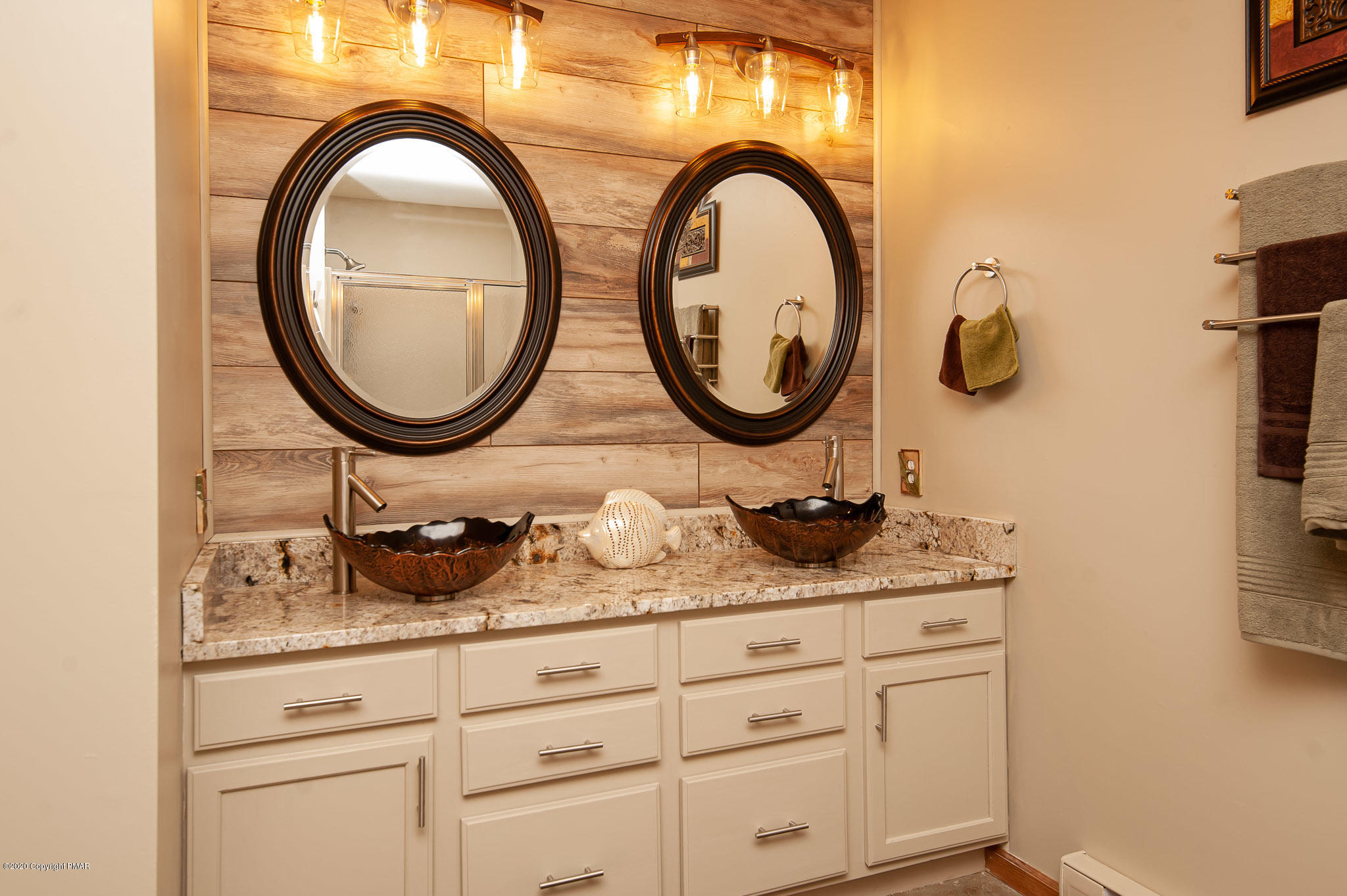 145 Salisbury Road Bushkill, PA 18324 - Photo 36 of 60 a bathroom with a granite countertop sink and a mirror