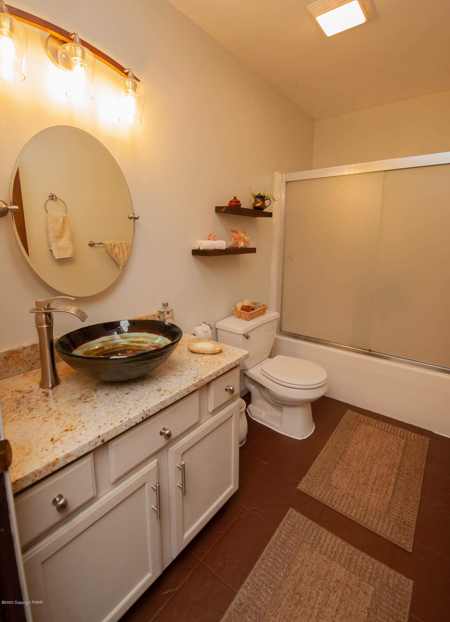 145 Salisbury Road Bushkill, PA 18324 - Photo 43 of 60 a bathroom with a granite countertop sink a toilet and a mirror
