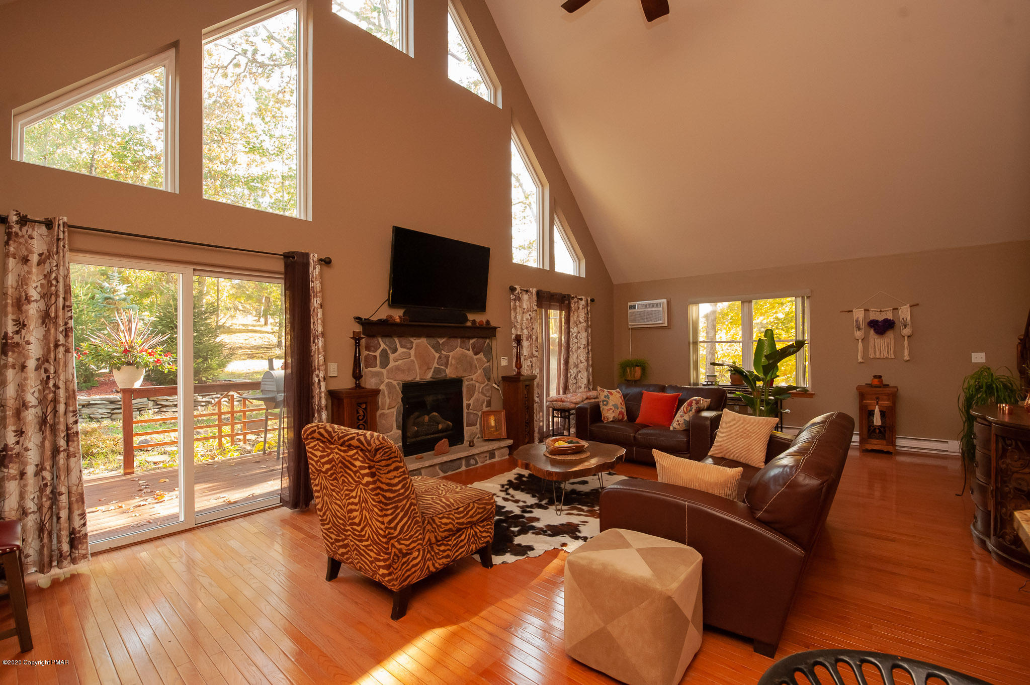 145 Salisbury Road Bushkill, PA 18324 - Photo 50 of 60 a living room with furniture a fireplace and a flat screen tv
