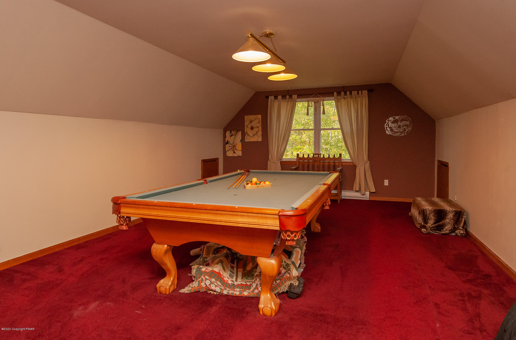 145 Salisbury Road Bushkill, PA 18324 - Photo 53 of 60 a room with a bed and a chandelier