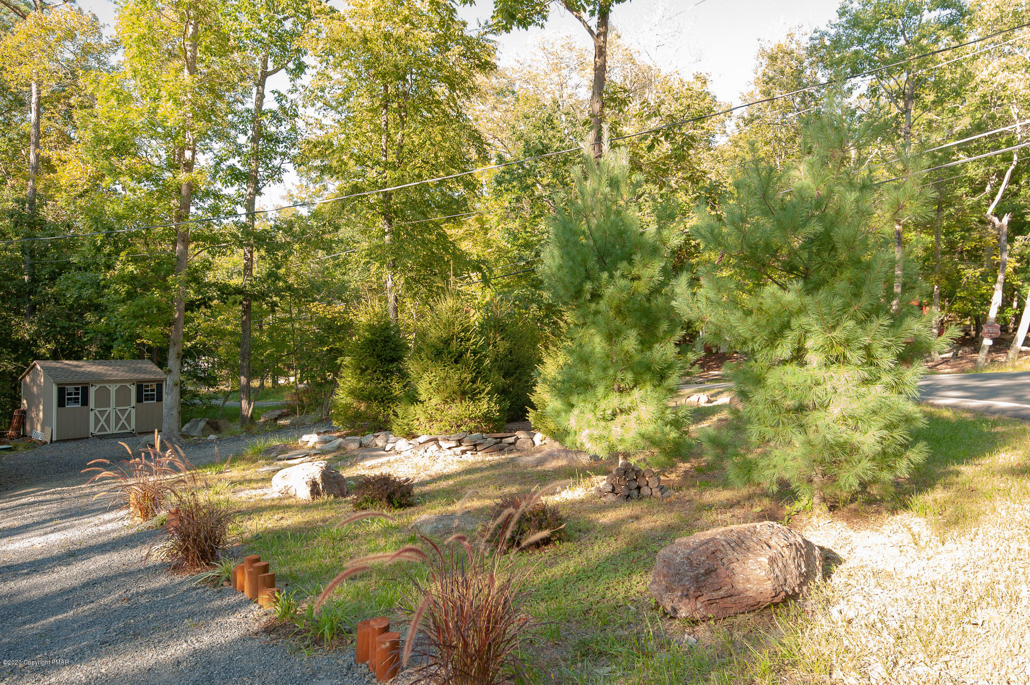 145 Salisbury Road Bushkill, PA 18324 - Photo 60 of 60 a backyard of a house with a yard and large trees