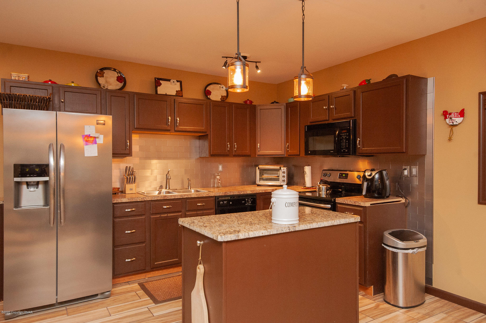 145 Salisbury Road Bushkill, PA 18324 - Photo 7 of 60 a kitchen with stainless steel appliances granite countertop a sink a stove and a refrigerator