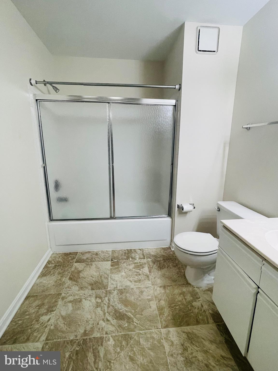 14229 Bowsprit Lane, Unit 501 Laurel, MD 20707 - Photo 10 of 19 a bathroom with a toilet and a shower