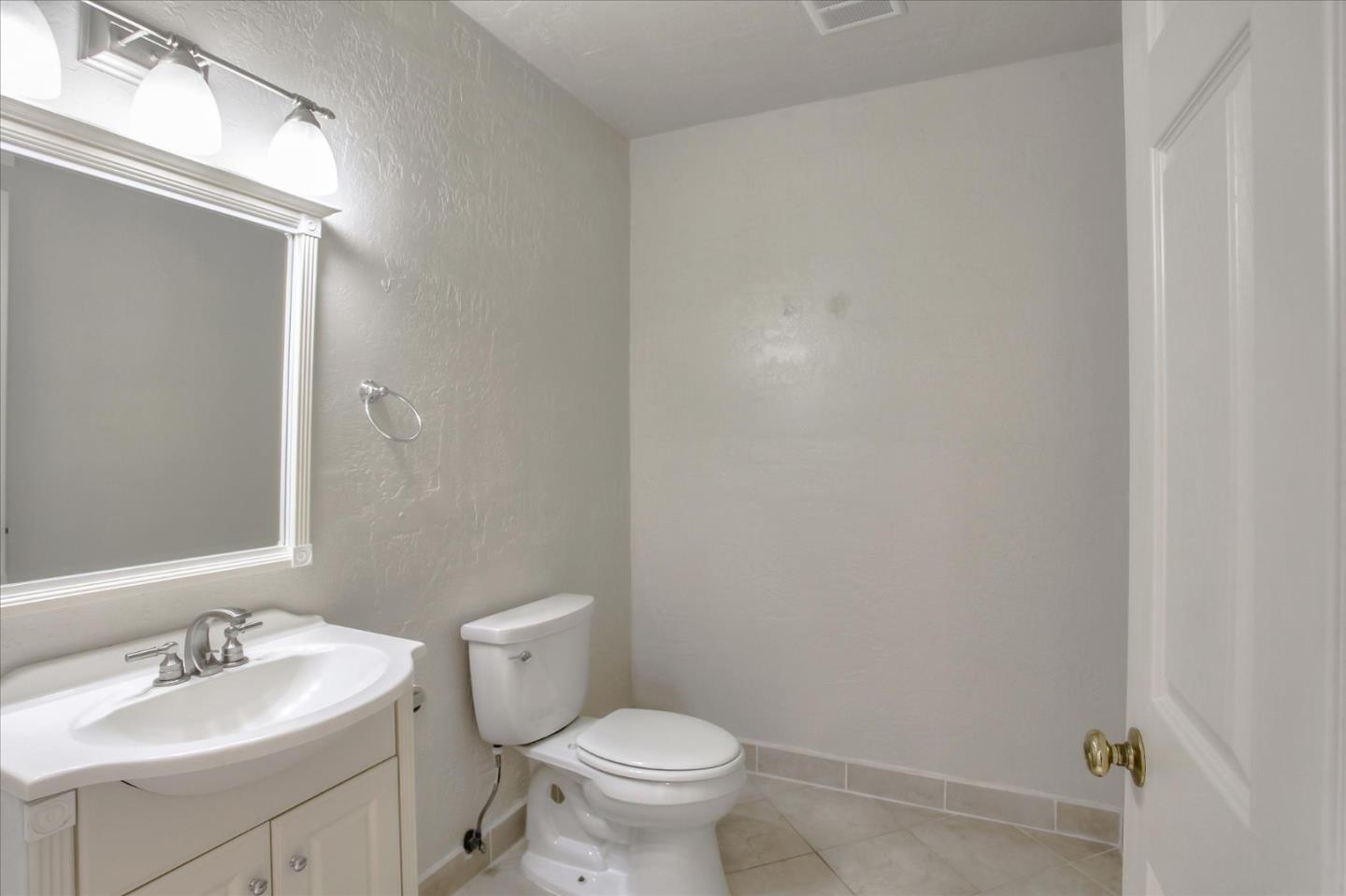 4060 Crest Road Pebble Beach, CA 93953 - Photo 44 of 54 a bathroom with a toilet a sink and mirror