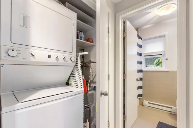 a bathroom with a toilet and a shower curtain