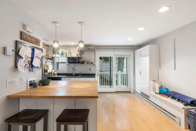 a kitchen with stainless steel appliances a sink stove and a refrigerator