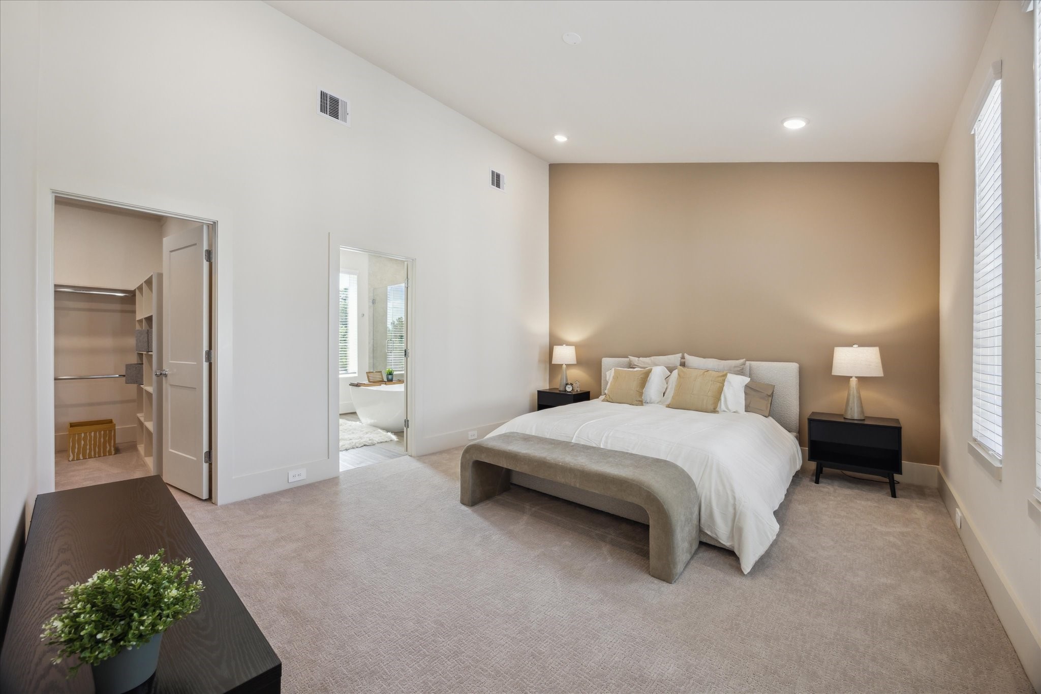 5903 Urban Pines Street Houston, TX 77091 - Photo 10 of 42 a spacious bedroom with a bed and a chandelier