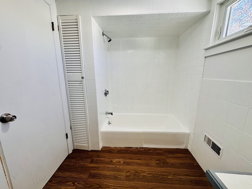 12 Thorndike Street, Unit 2 Salem, MA 01970 - Photo 6 of 16 a bathroom with a tub and shower
