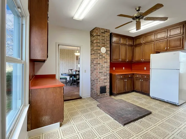 a view of empty room with windows and stairs