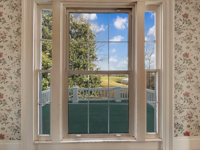 a view of a swimming pool with outdoor seating