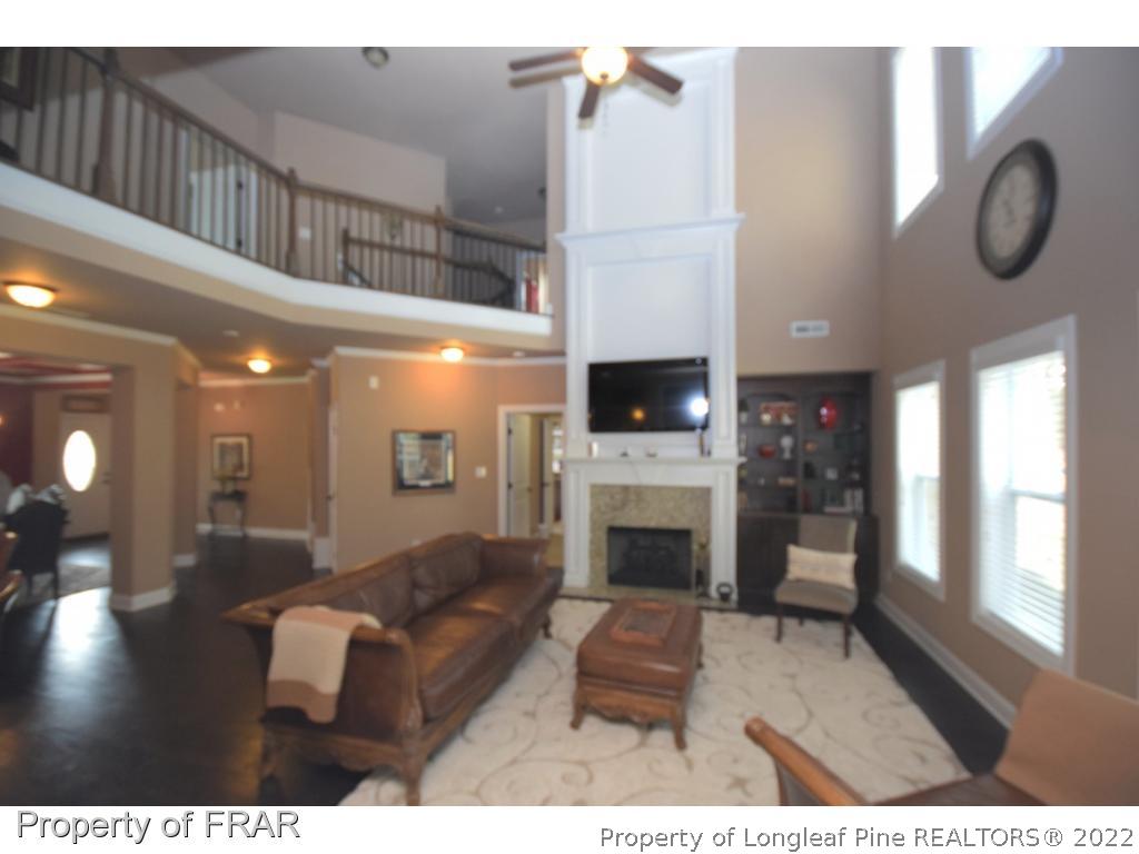 1804 Micahs Way North Spring Lake, NC 28390 - Photo 11 of 30 a living room with furniture and a fireplace