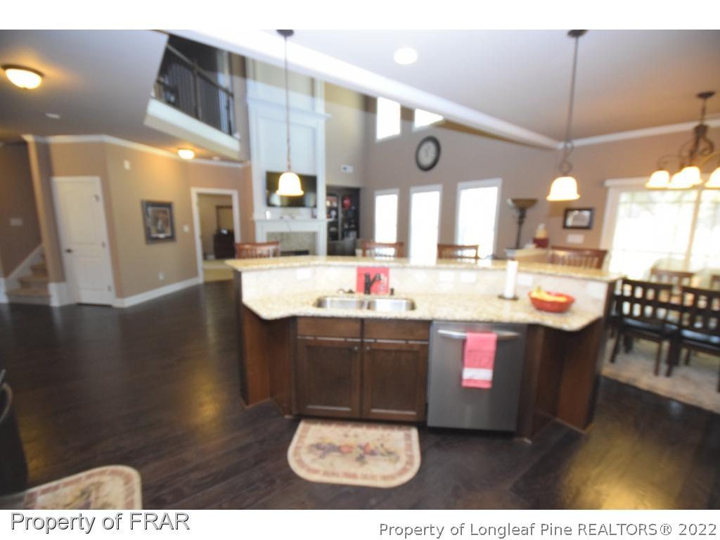 1804 Micahs Way North Spring Lake, NC 28390 - Photo 12 of 30 a kitchen with a sink and cabinets