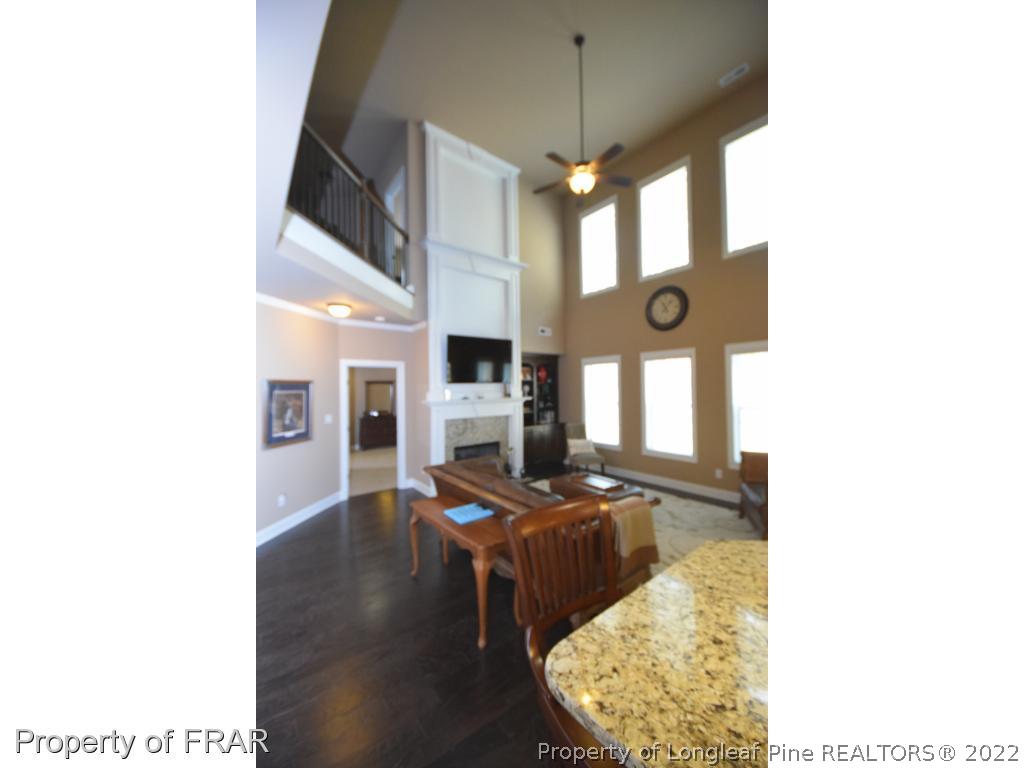 1804 Micahs Way North Spring Lake, NC 28390 - Photo 15 of 30 a living room with furniture and a fireplace