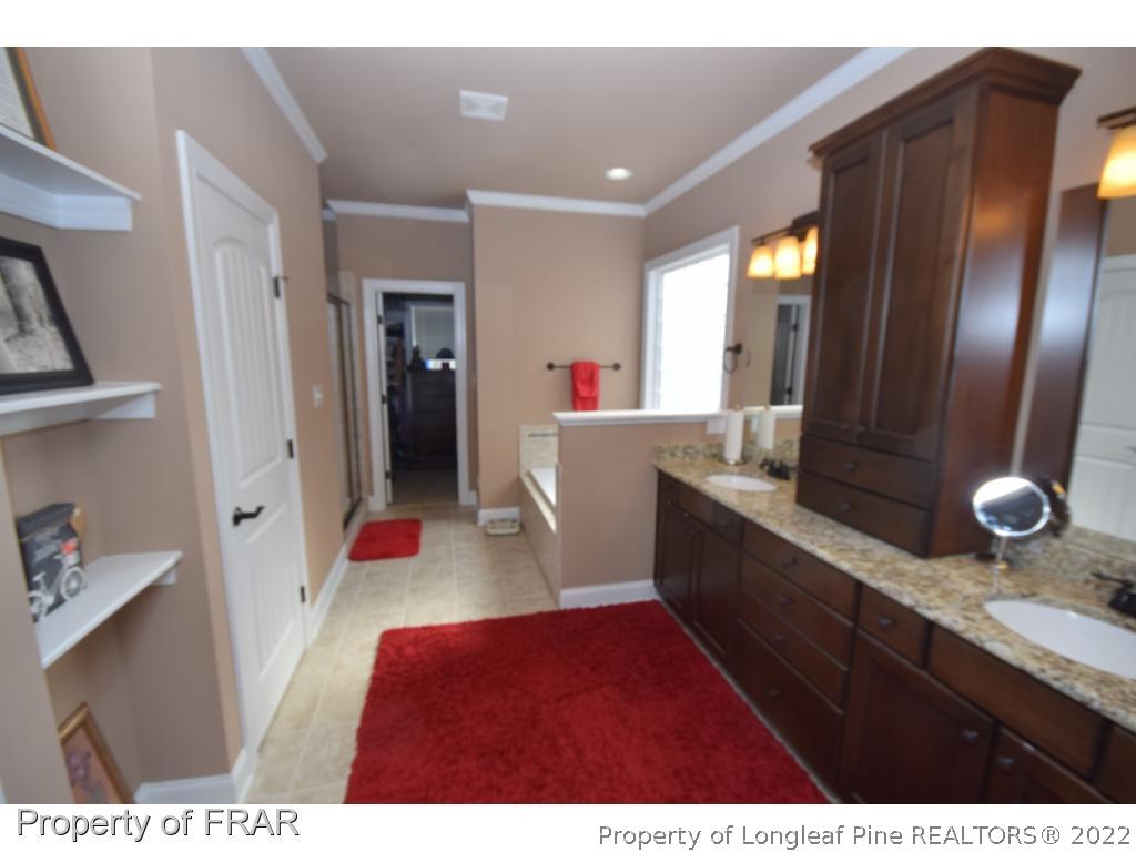 1804 Micahs Way North Spring Lake, NC 28390 - Photo 26 of 30 a living room with furniture and a flat screen tv