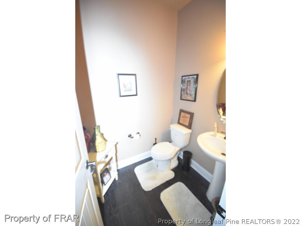 1804 Micahs Way North Spring Lake, NC 28390 - Photo 29 of 30 a white toilet sitting next to a bathroom sink