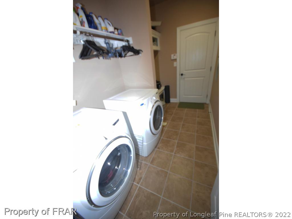 1804 Micahs Way North Spring Lake, NC 28390 - Photo 30 of 30 a utility room with dryer and washer