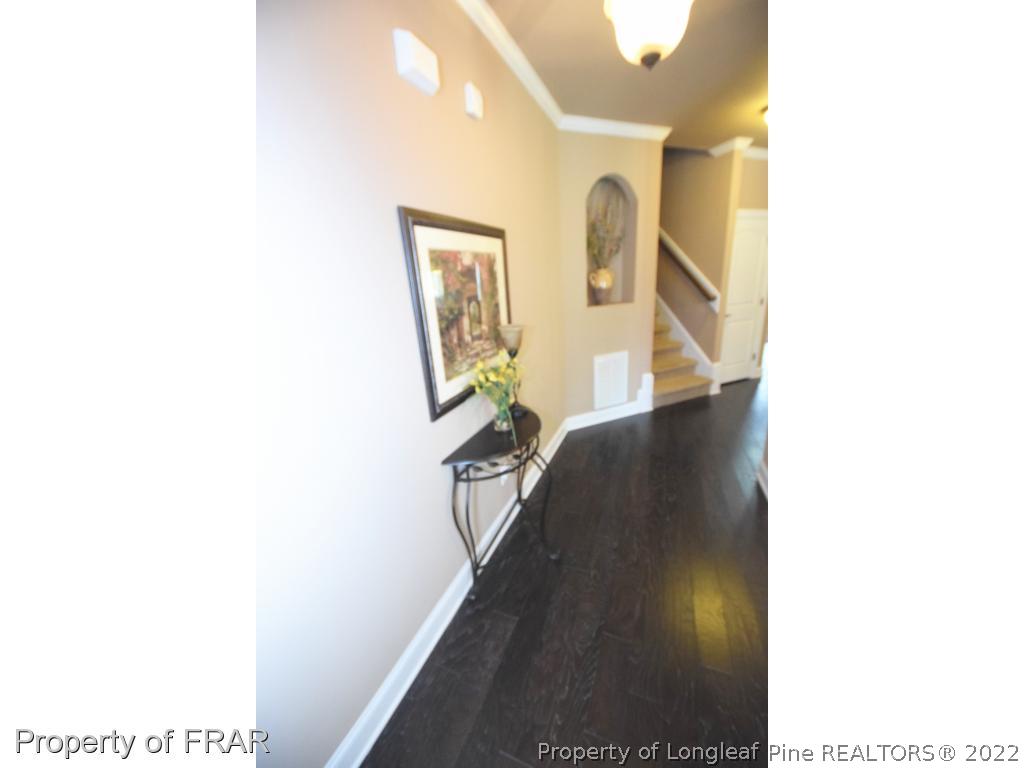 1804 Micahs Way North Spring Lake, NC 28390 - Photo 6 of 30 a view of a living room with a chair