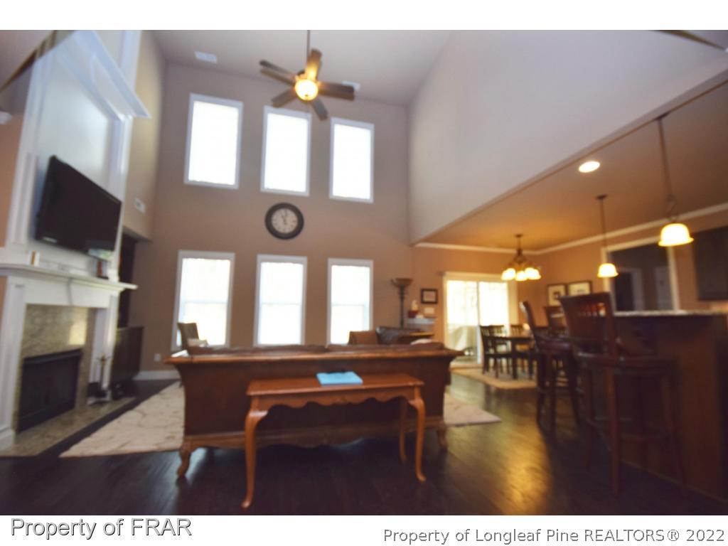 1804 Micahs Way North Spring Lake, NC 28390 - Photo 8 of 30 a view of a dining room with furniture and a fireplace