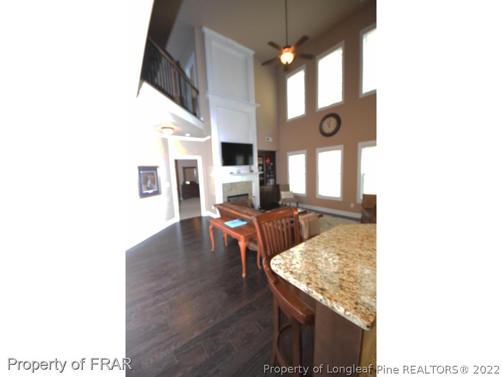 1804 Micahs Way North Spring Lake, NC 28390 - Photo 9 of 30 a living room with furniture and a fireplace