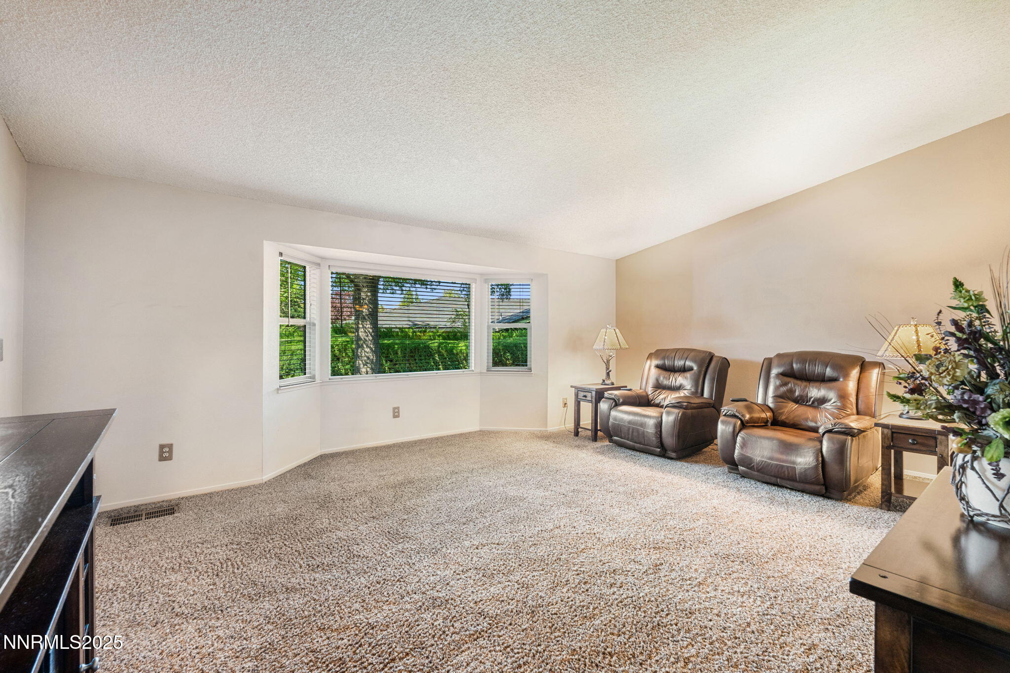 8678 Strutter Way Reno, NV 89506 - Photo 11 of 38 a living room with furniture and a floor to ceiling window