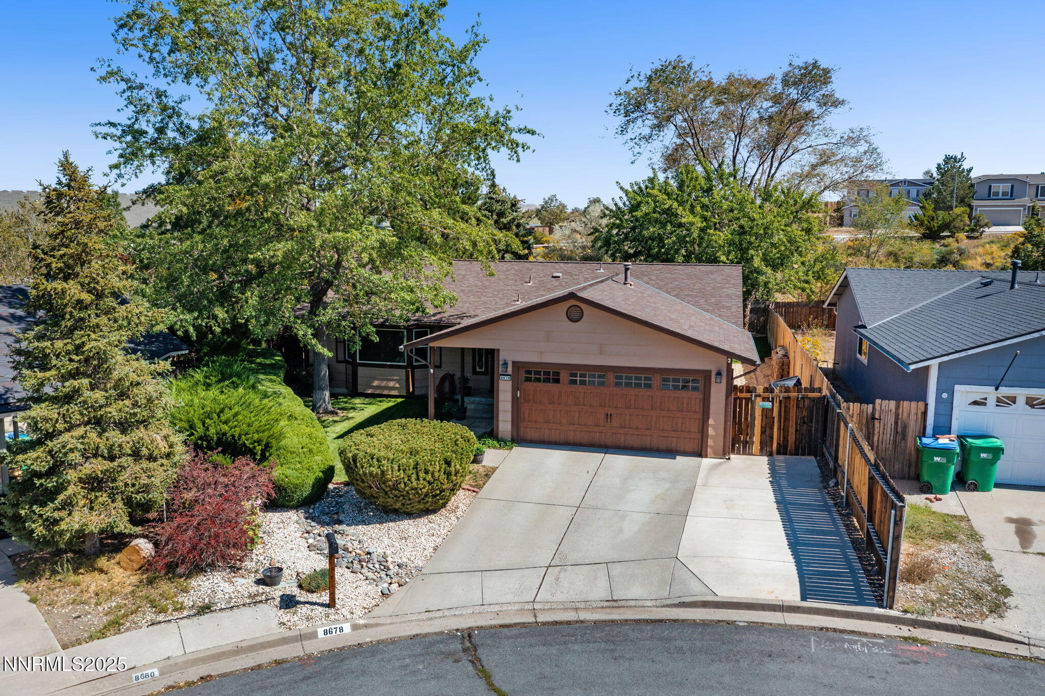 8678 Strutter Way Reno, NV 89506 - Photo 2 of 38 front view of a house with a yard