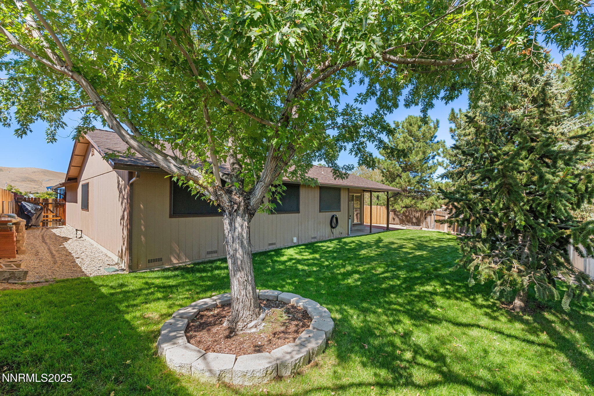 8678 Strutter Way Reno, NV 89506 - Photo 36 of 38 a front view of a house with a yard