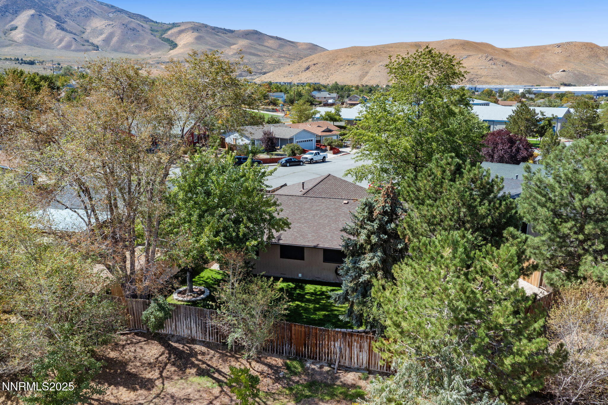 8678 Strutter Way Reno, NV 89506 - Photo 38 of 38 a view of a house with a mountain in the background
