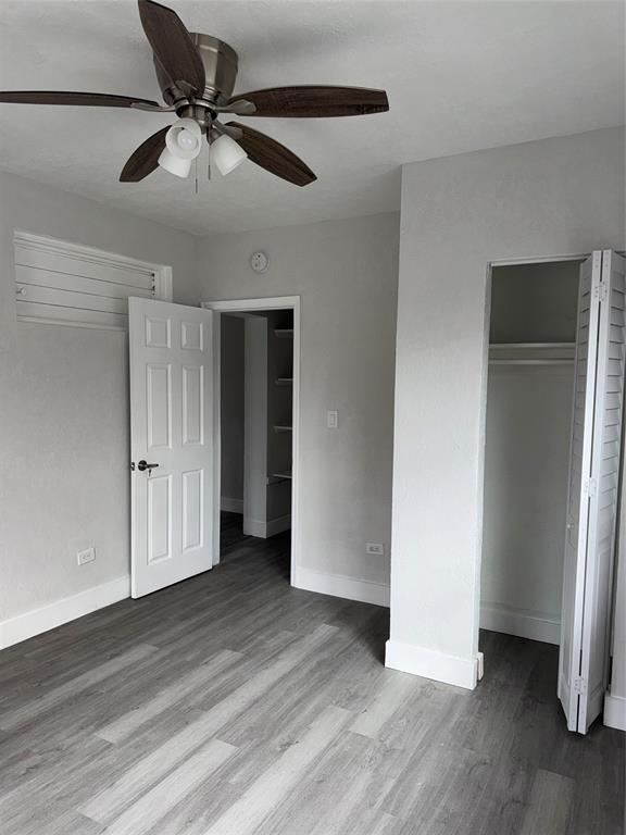 731 Northwest 56th Street, Unit 101 Miami, FL 33127 - Photo 7 of 11 a view of an empty room with wooden floor