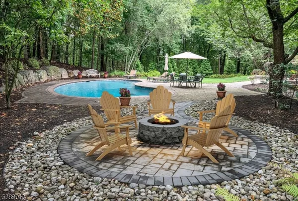 a view of a backyard with sitting area