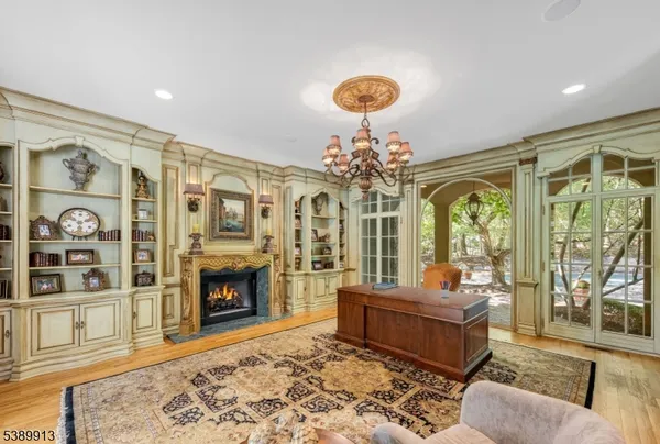 a living room with furniture windows and a fireplace