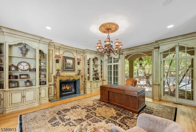 a living room with furniture windows and a fireplace