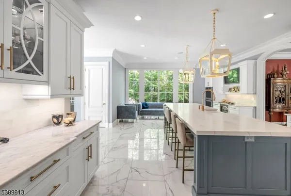 a kitchen with sink cabinets and living room view