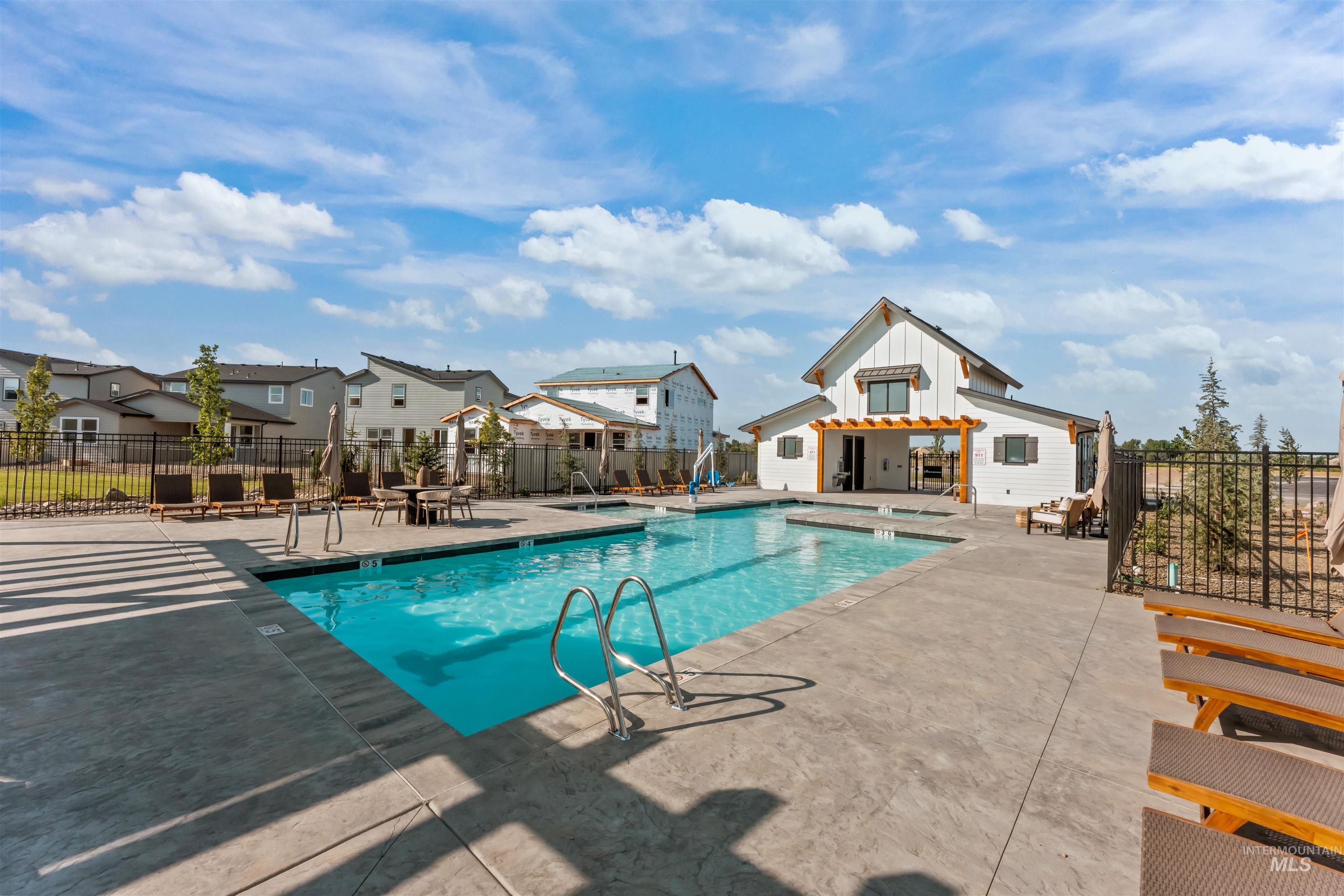 12499 West Callisto Lane Star, ID 83669 - Photo 36 of 38 Community pool with a patio, a hot tub, and a residential view