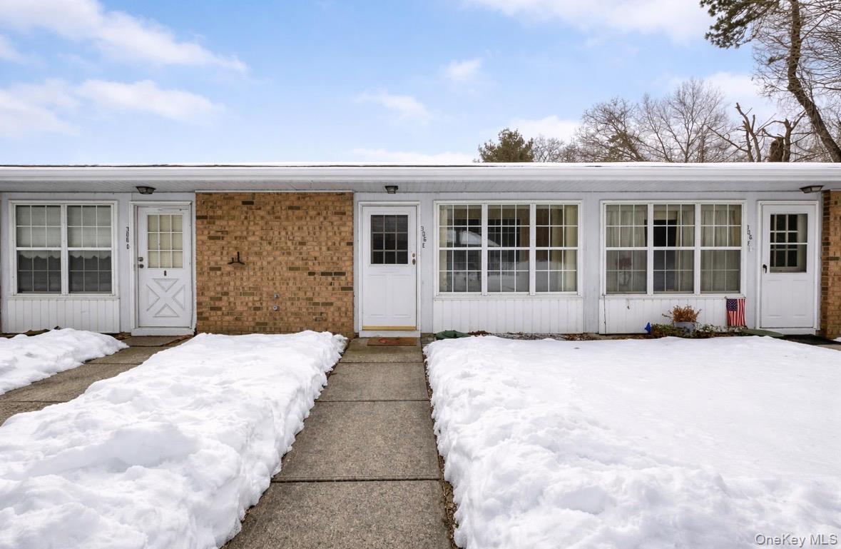 306 Torquay Court, Unit E Ridge, NY 11961 - Photo 1 of 12 a view of a house with a outdoor space