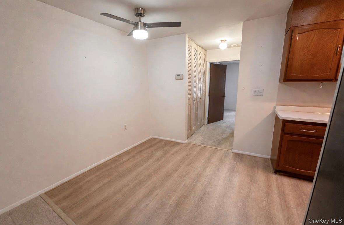 306 Torquay Court, Unit E Ridge, NY 11961 - Photo 6 of 12 a view of a livingroom with a fireplace