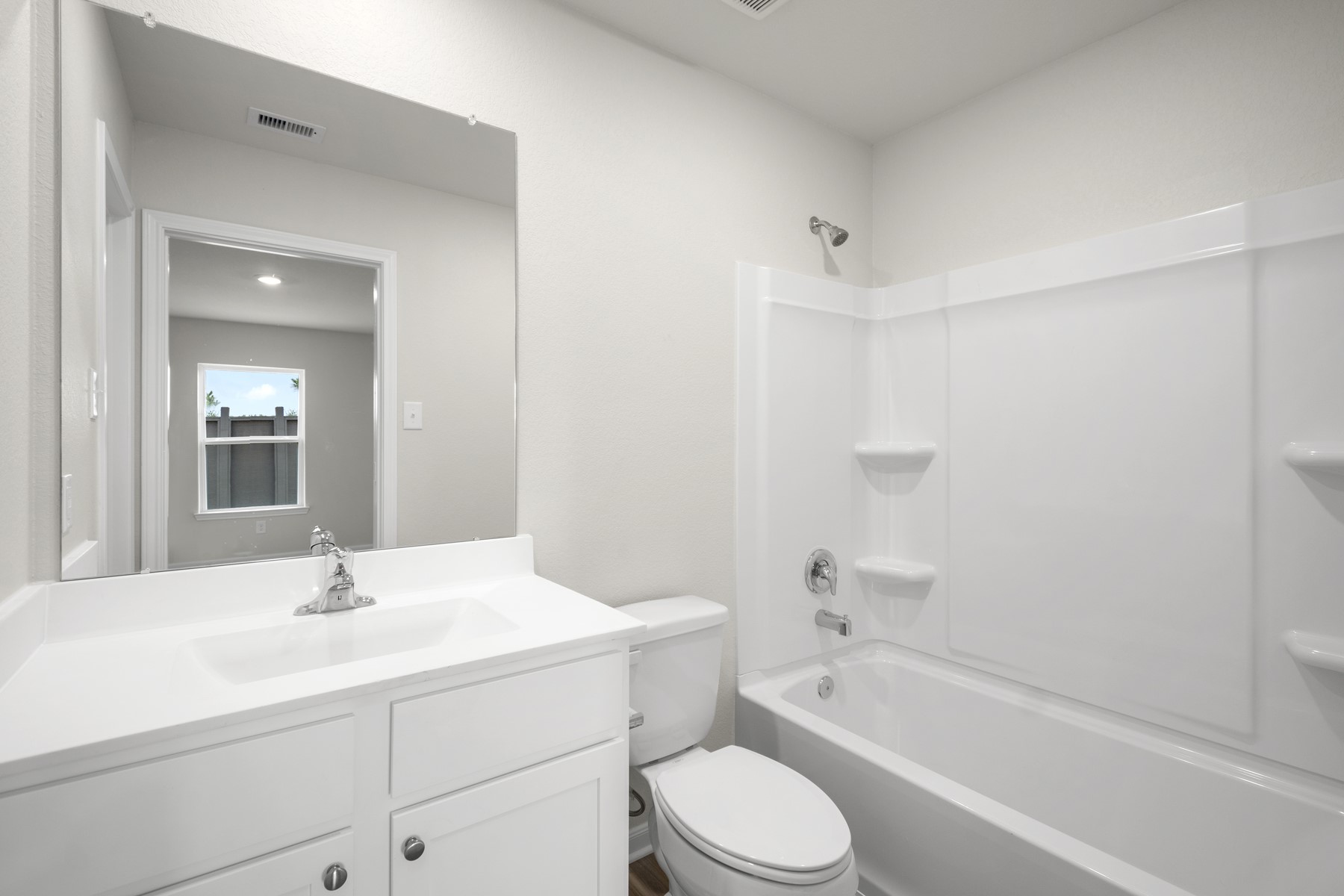 15866 Berry Hl Drive Conroe, TX 77303 - Photo 2 of 20 a bathroom with a bathtub shower sink vanity mirror and toilet