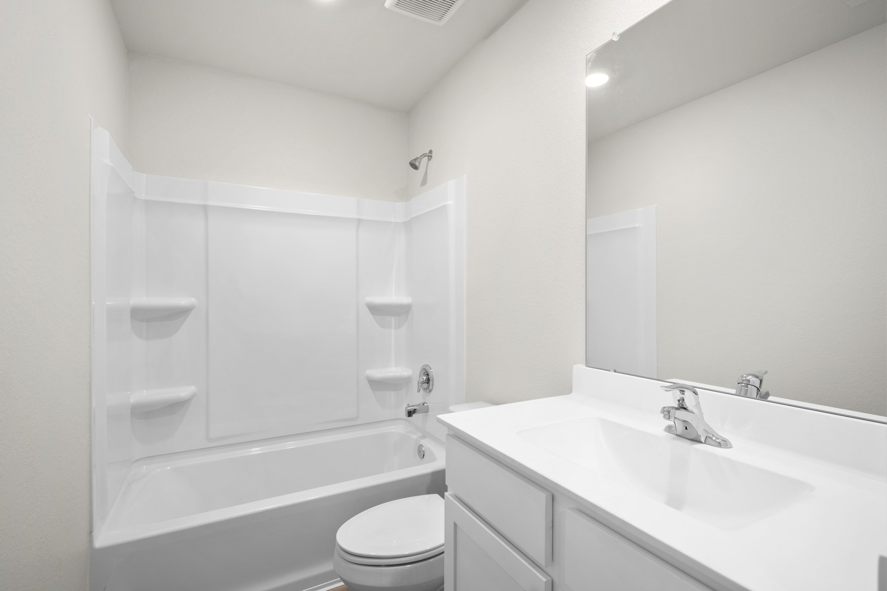 15866 Berry Hl Drive Conroe, TX 77303 - Photo 3 of 20 a bathroom with a bathtub shower sink vanity mirror and toilet