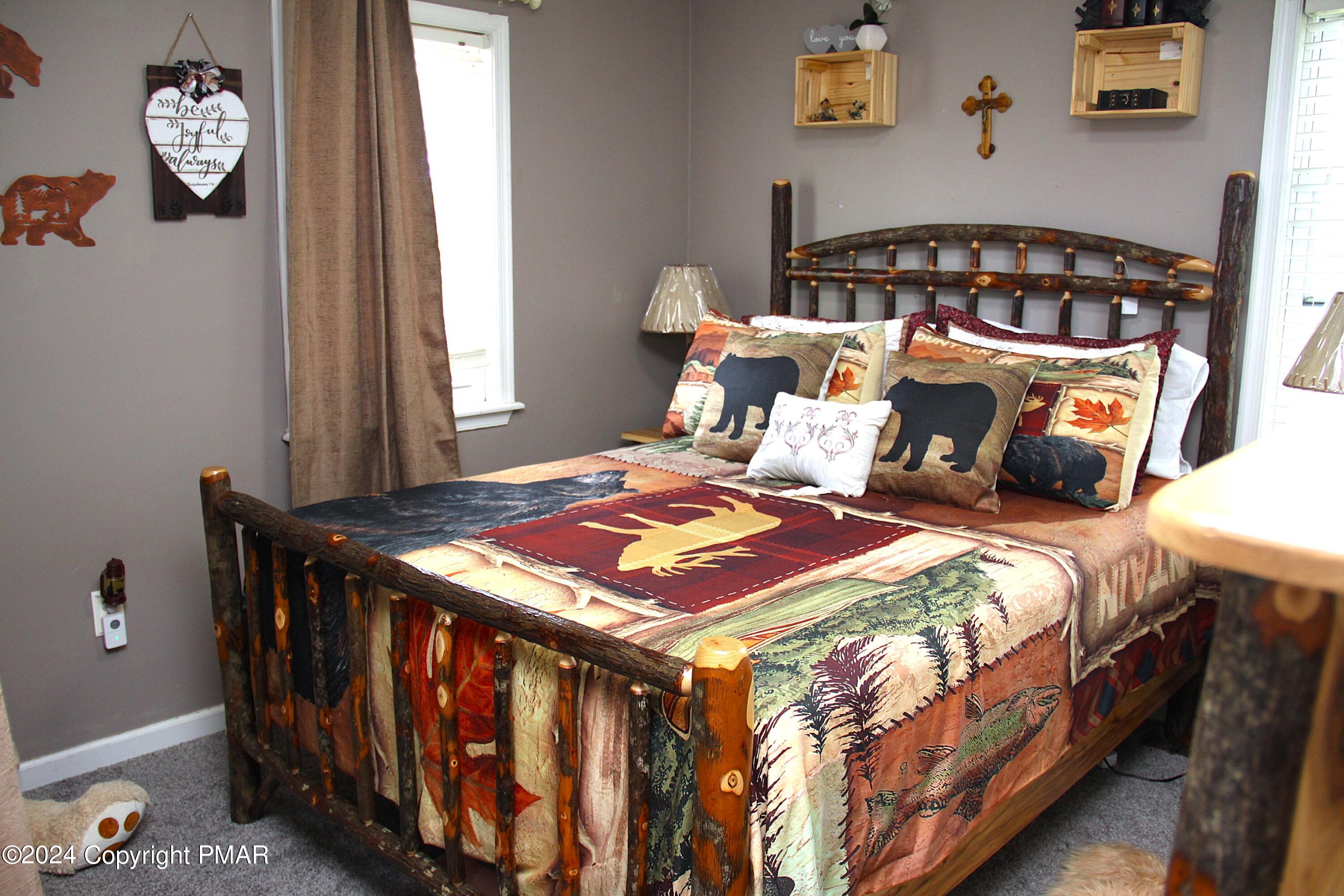 894 Spring Hill Road Sterling, PA 18463 - Photo 8 of 34 a bedroom with bed and a window