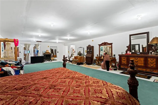 a bed room with a bed and a large mirror